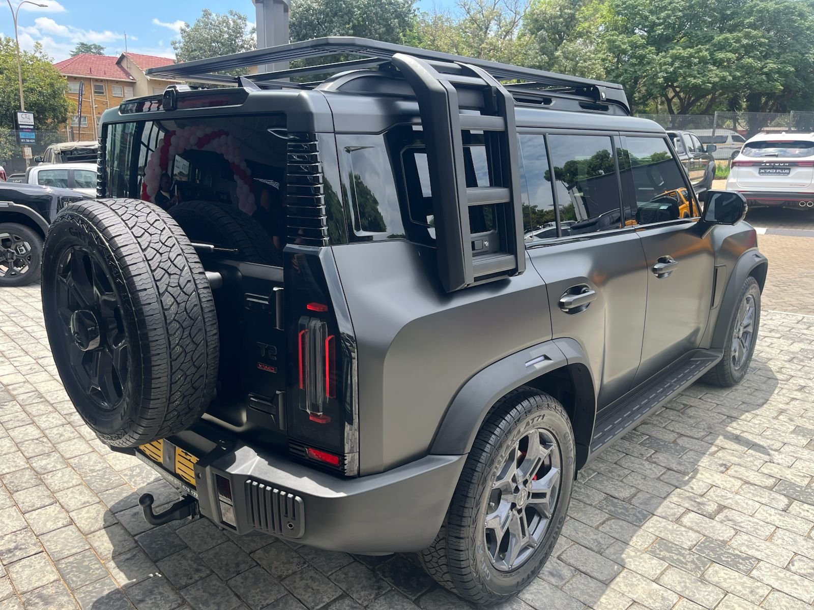 Dark grey Jetour T2 rear three-quarter view
