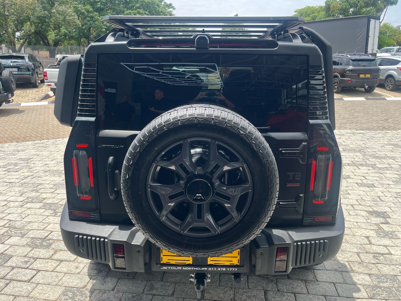 Dark grey Jetour T2 rear view with spare wheel