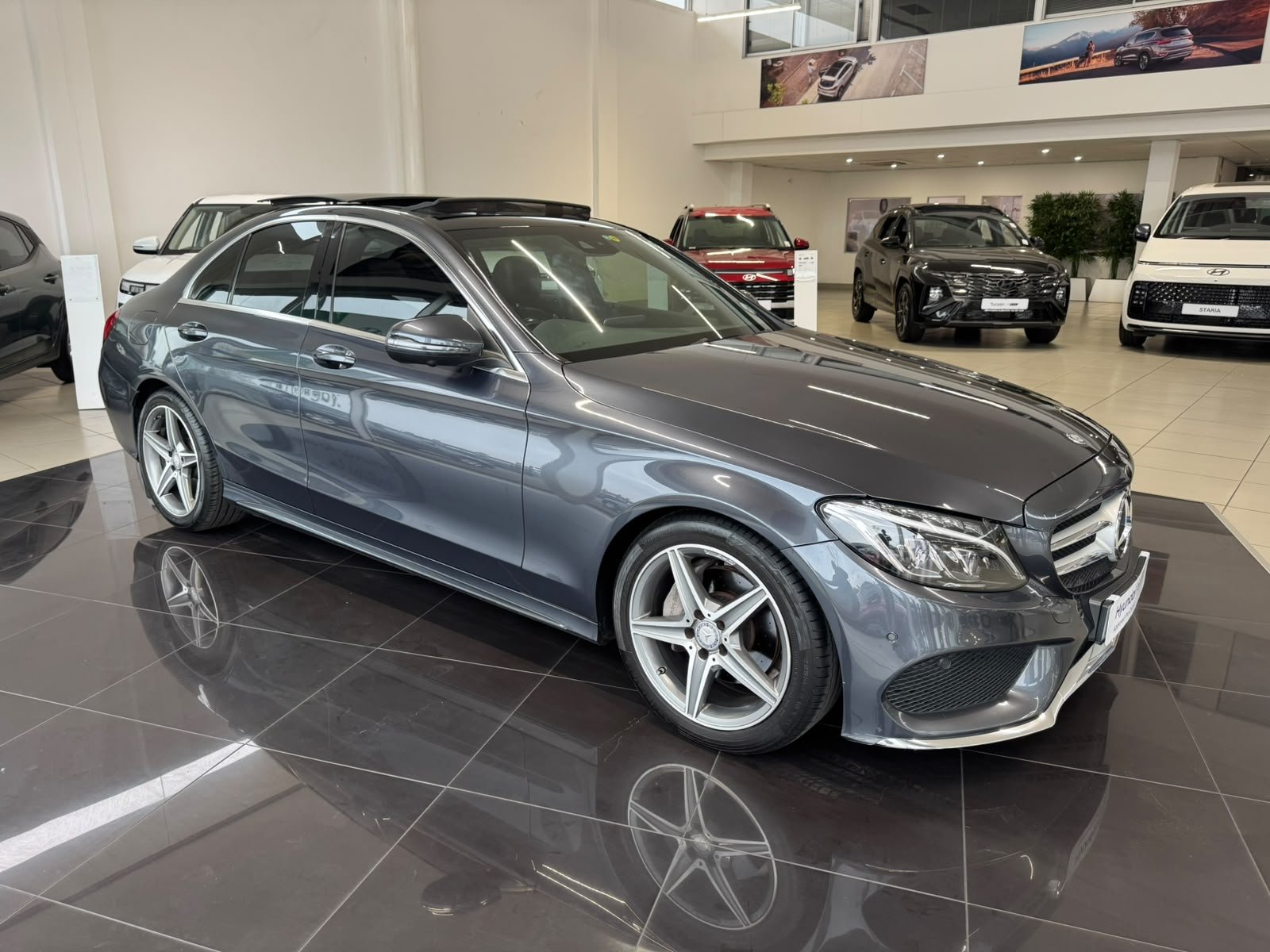 Grey Mercedes-Benz C-Class front three-quarter view