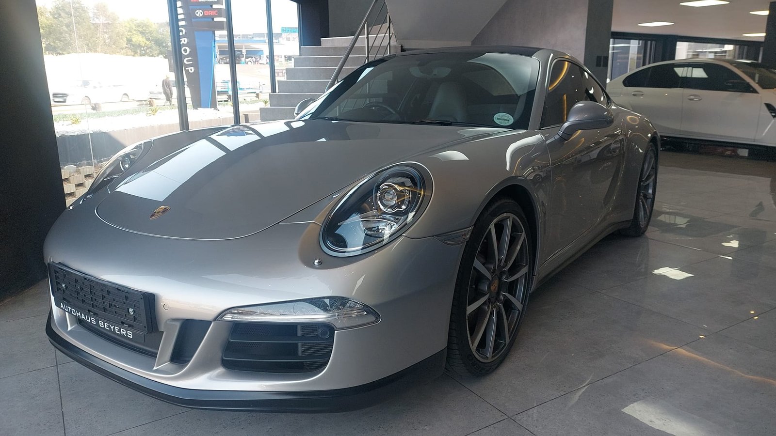 Silver Porsche 911 Carrera 4S front three-quarter view