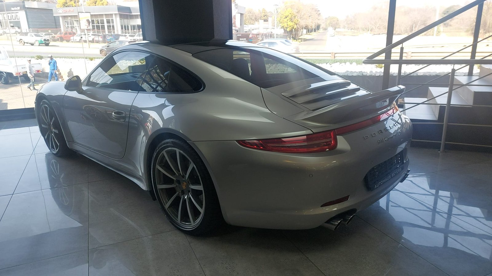 Silver Porsche 911 Carrera 4S rear three-quarter view