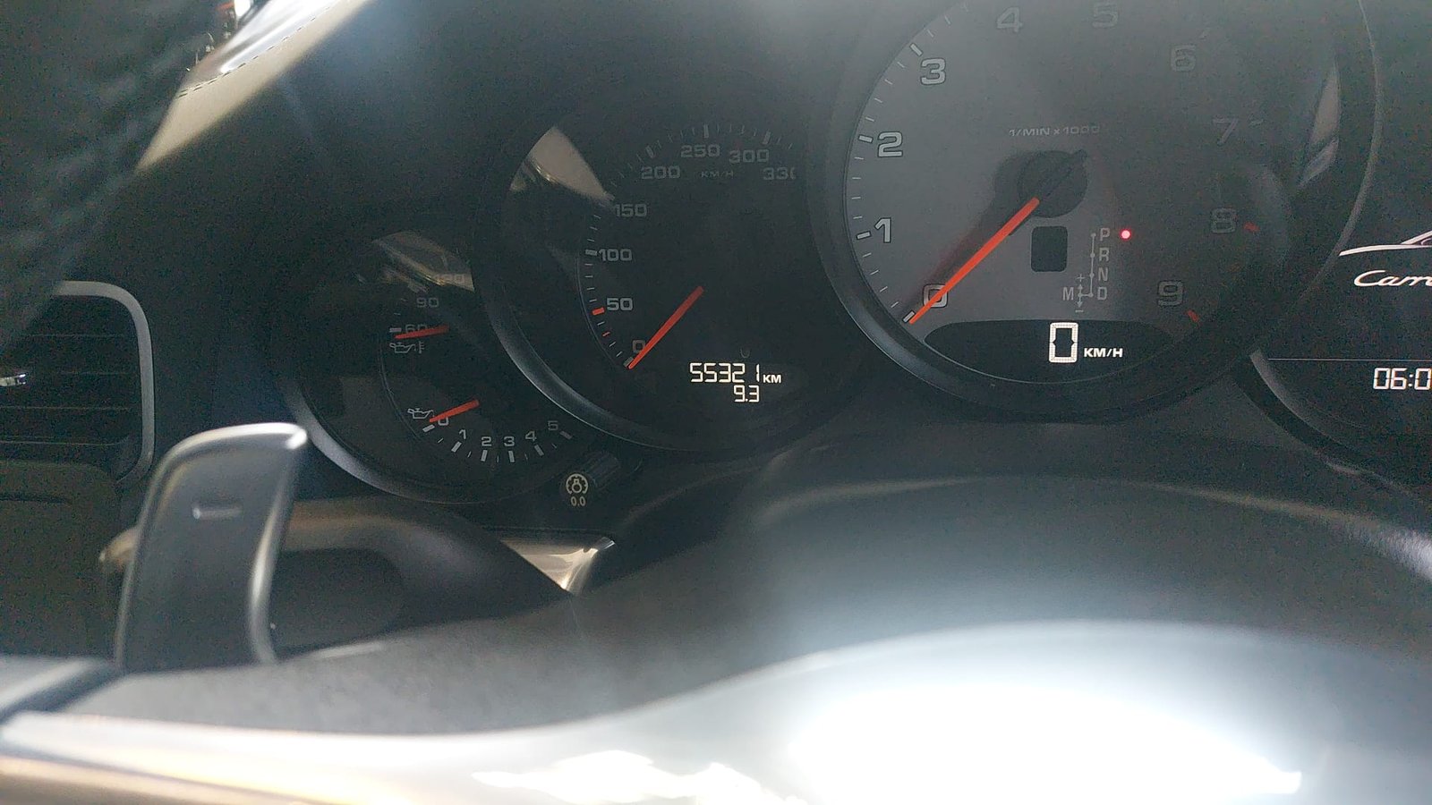 Porsche 911 Carrera 4S instrument cluster showing mileage