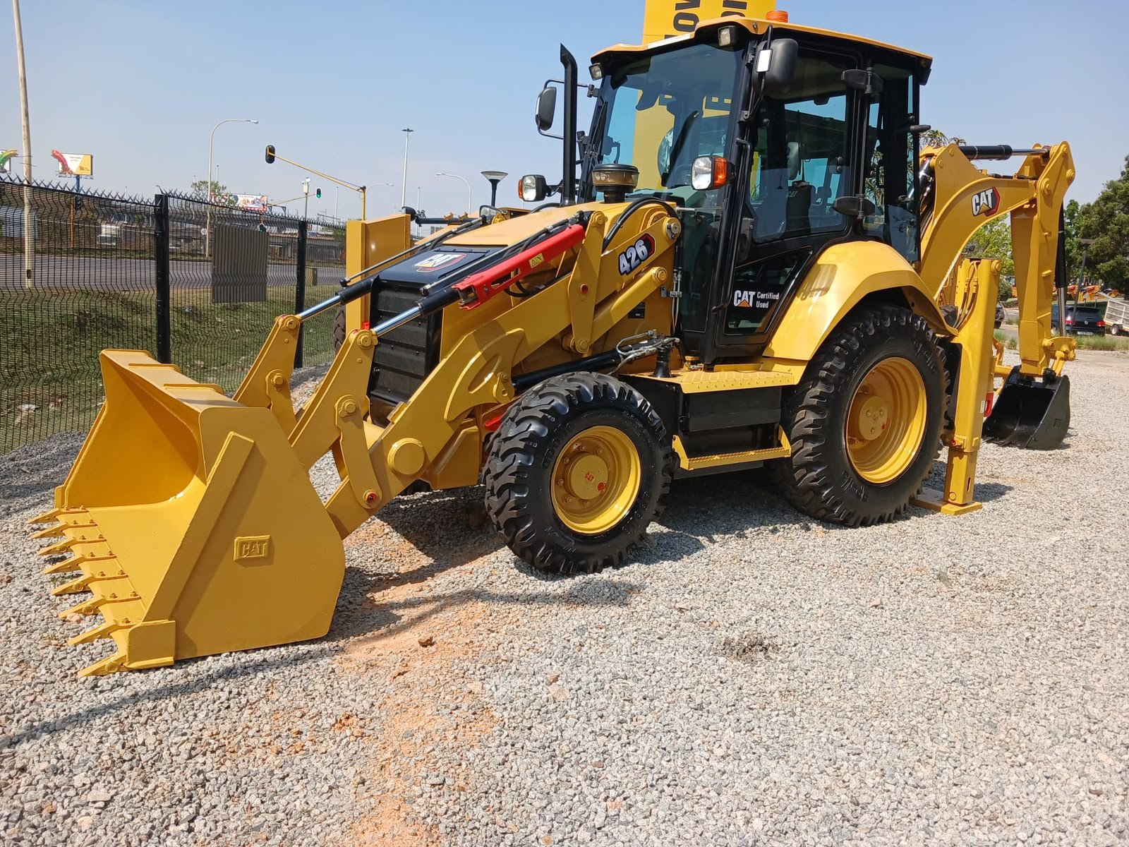 Cat 426F2 backhoe loader front three-quarter view